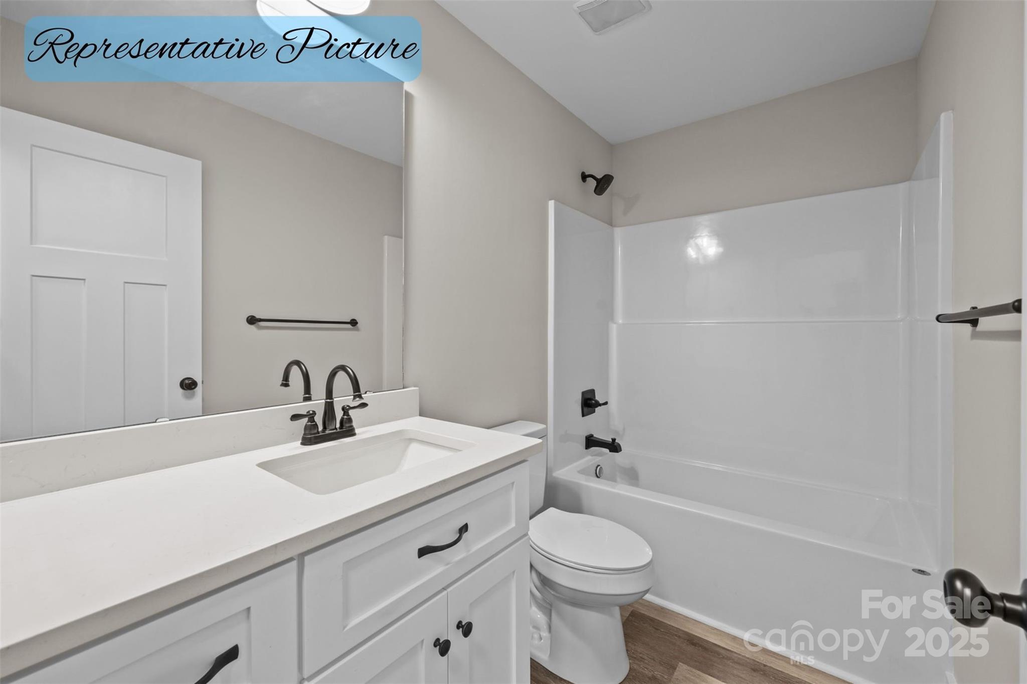 36220 Gene Road New London, NC 28127 - Photo 26 of 42 a bathroom with a sink a toilet and shower