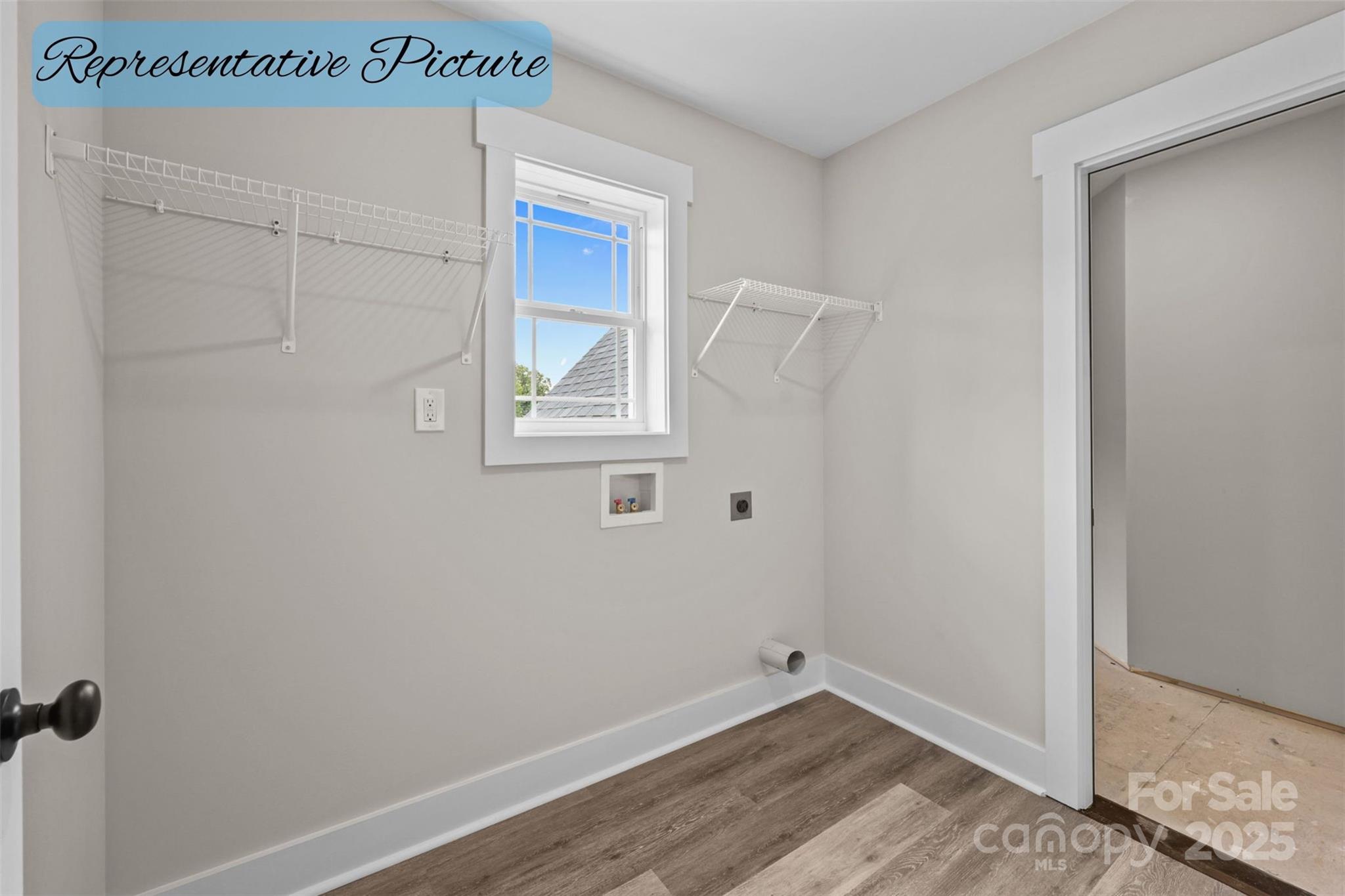 36220 Gene Road New London, NC 28127 - Photo 31 of 42 a view of an empty room with wooden floor and a window