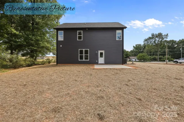 a house that has a tree in front of it