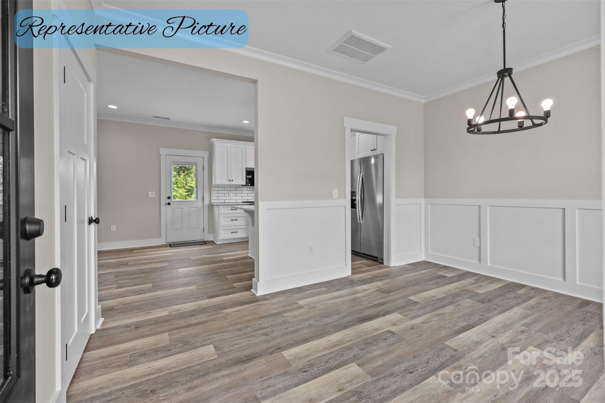 36220 Gene Road New London, NC 28127 - Photo 6 of 42 a view of empty room with wooden floor and window