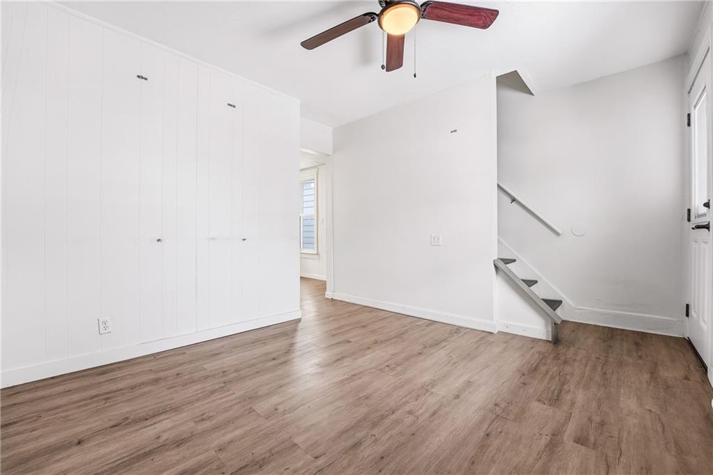 316 Mitchell Avenue Butler, PA 16001 - Photo 4 of 20 an empty room with wooden floor fan and windows