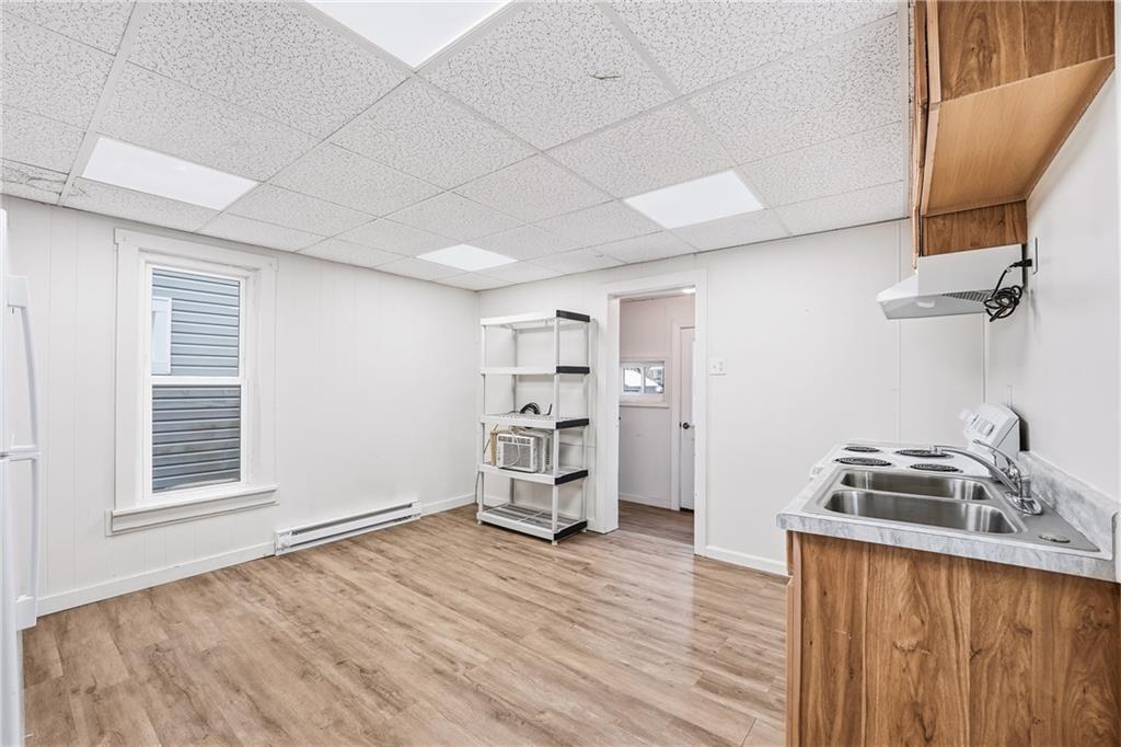 316 Mitchell Avenue Butler, PA 16001 - Photo 10 of 20 a room with a bed and wooden floor