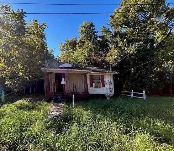 front view of a house with a garden