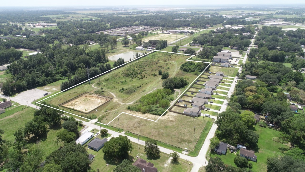 an aerial view of residential houses with outdoor space