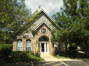 43 Foxcroft Road, Unit 103 Naperville, IL 60565 - Photo 16 of 18 a front view of a house with a garden