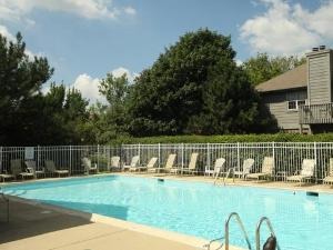 43 Foxcroft Road, Unit 103 Naperville, IL 60565 - Photo 17 of 18 a view of a lake with a yard and a fountain