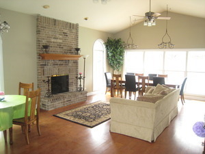 43 Foxcroft Road, Unit 103 Naperville, IL 60565 - Photo 18 of 18 a living room with furniture and a fireplace