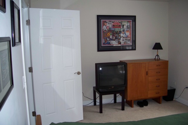 43 Foxcroft Road, Unit 103 Naperville, IL 60565 - Photo 10 of 18 a room with a cabinet and a table