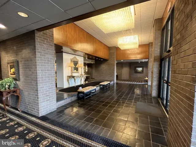a kitchen with granite countertop lots of wooden cabinets