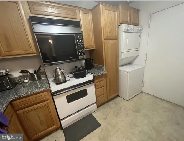 a kitchen with a stove and a microwave