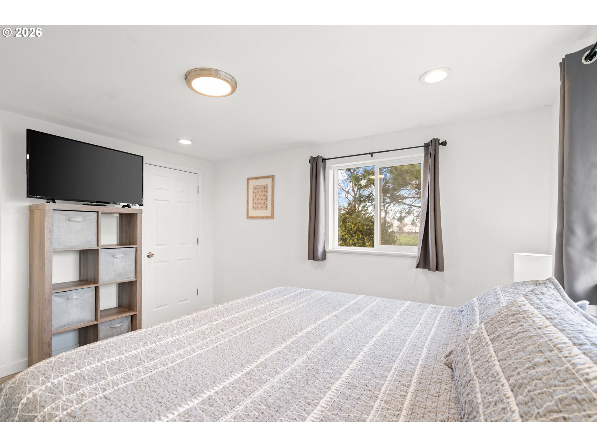 2130 Southeast 19th Street Hermiston, OR 97838 - Photo 12 of 32 a bedroom with a bed and a flat screen tv