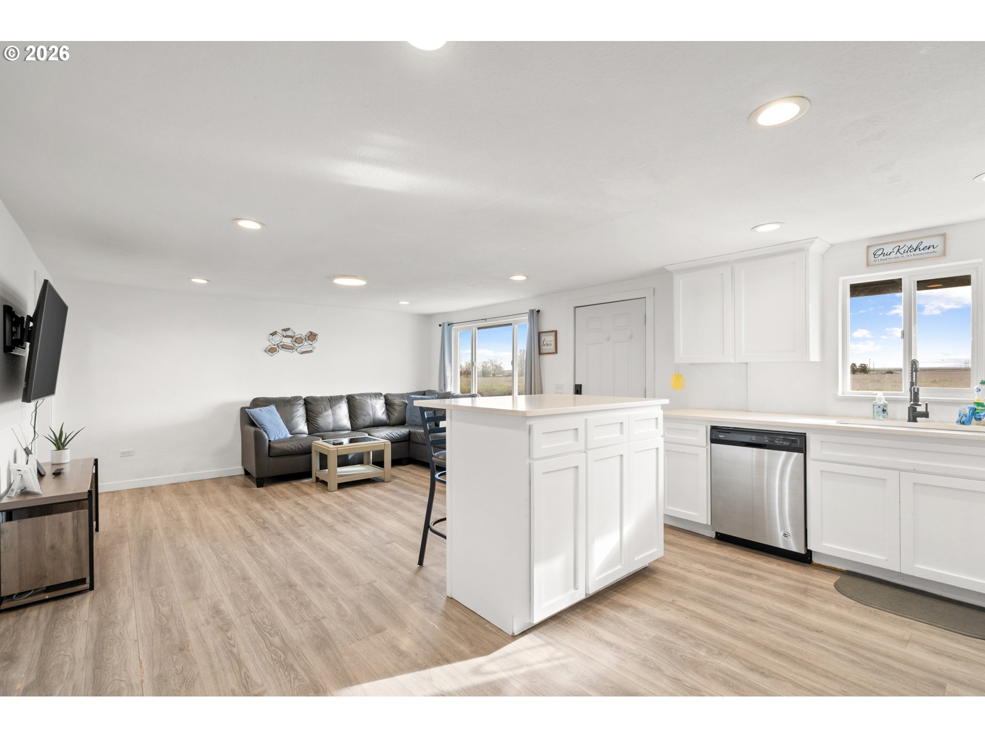 2130 Southeast 19th Street Hermiston, OR 97838 - Photo 15 of 32 a large white kitchen with stainless steel appliances lots of white cabinets