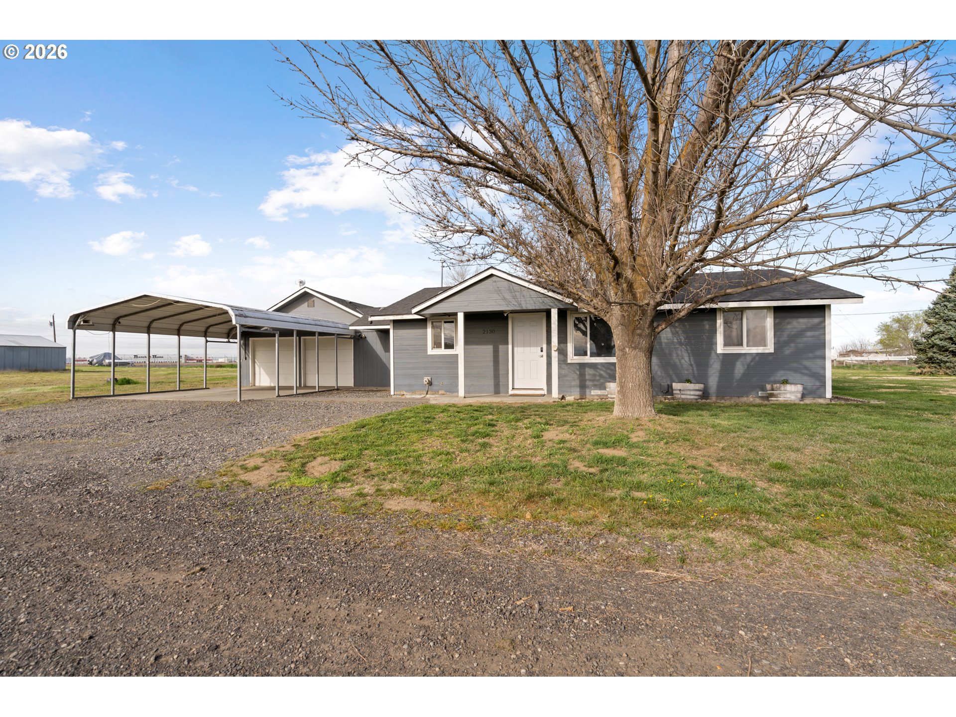2130 Southeast 19th Street Hermiston, OR 97838 - Photo 21 of 32 a view of a house with a backyard