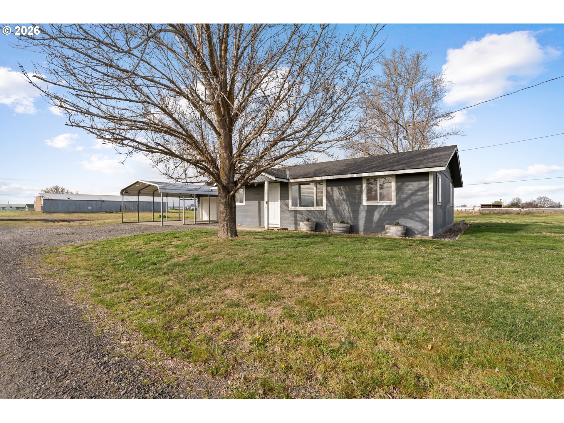 2130 Southeast 19th Street Hermiston, OR 97838 - Photo 22 of 32 a front view of a house with garden
