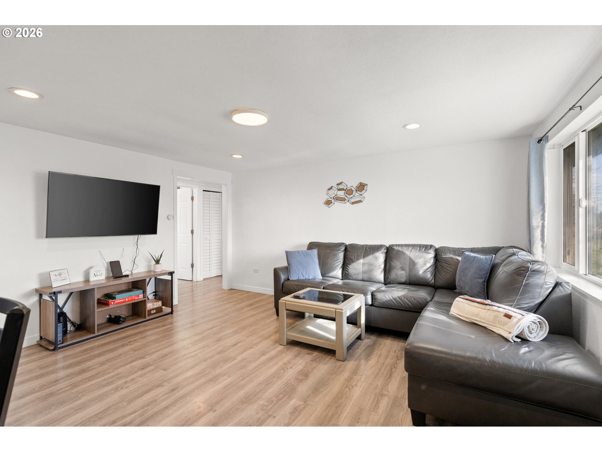 2130 Southeast 19th Street Hermiston, OR 97838 - Photo 3 of 32 a living room with furniture and a flat screen tv