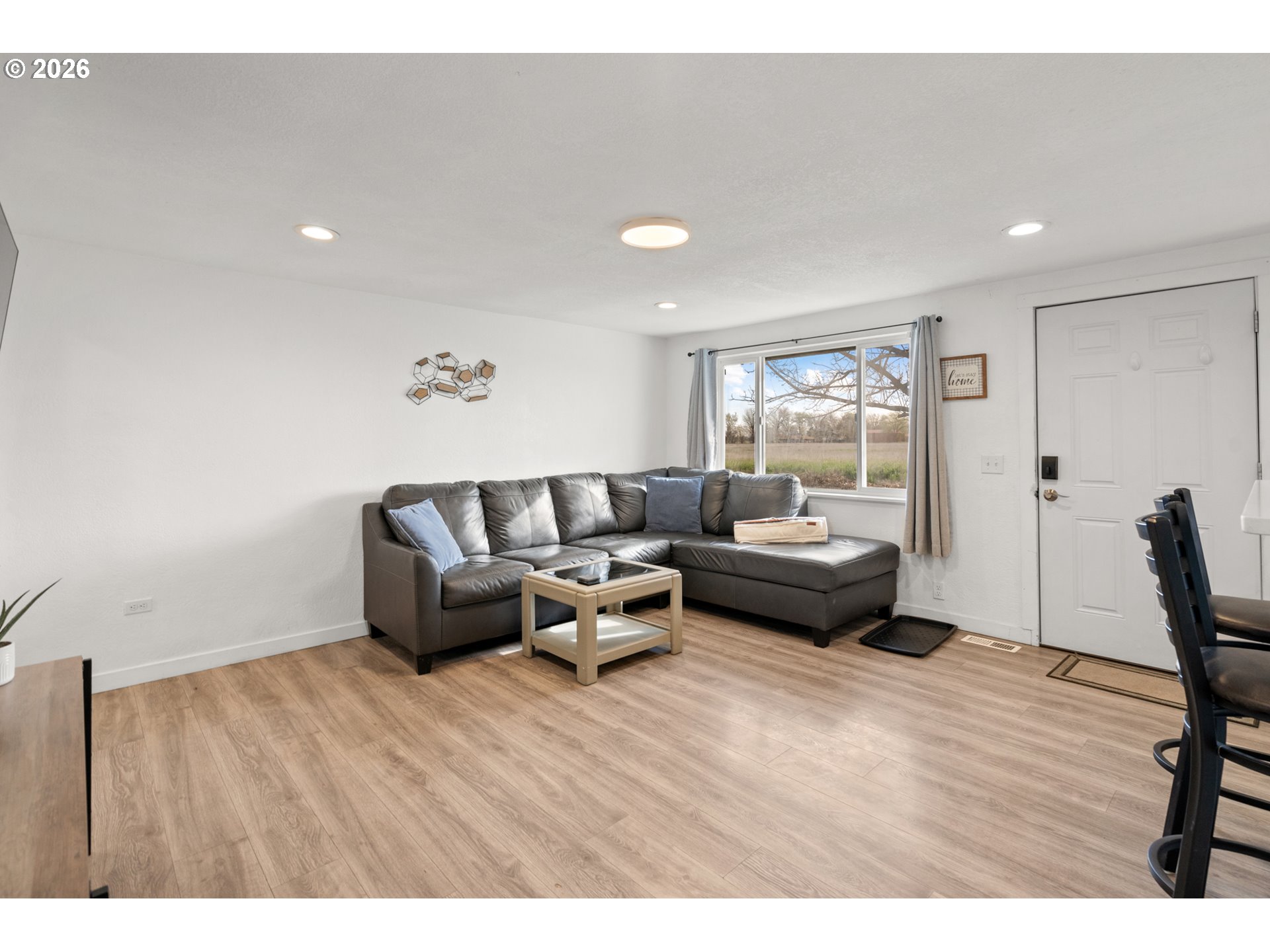 2130 Southeast 19th Street Hermiston, OR 97838 - Photo 4 of 32 a living room with furniture and a wooden floor
