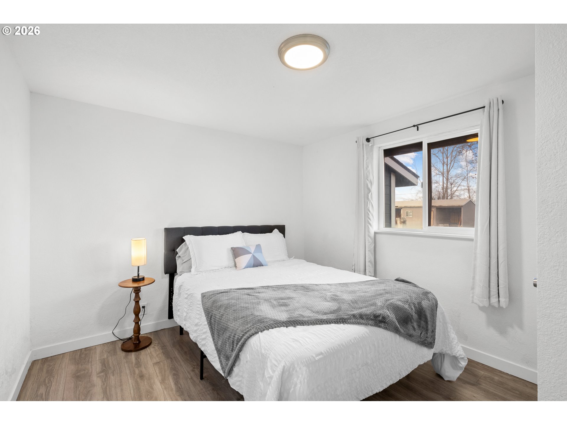 2130 Southeast 19th Street Hermiston, OR 97838 - Photo 10 of 32 a bedroom with a bed and a window