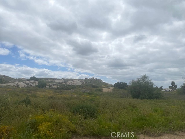 0 Yucca Road Perris, CA 92570 - Photo 2 of 11 a view of a big yard and mountain in back