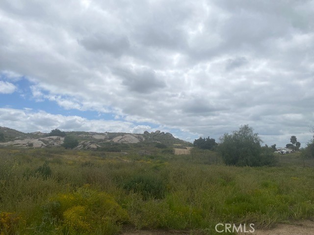 0 Yucca Road Perris, CA 92570 - Photo 3 of 11 a view of a big yard and mountain in back