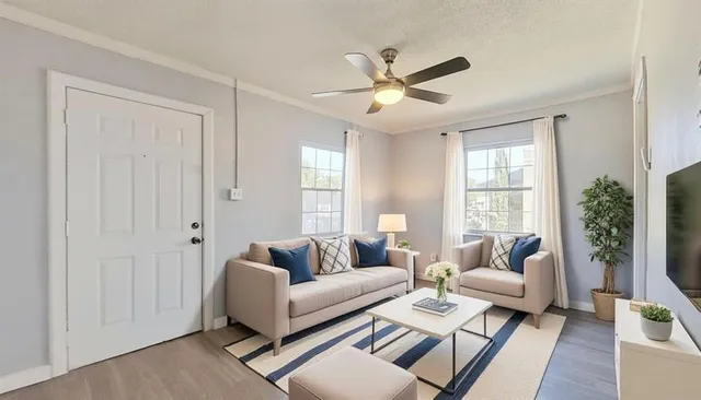 a living room with furniture and a large window