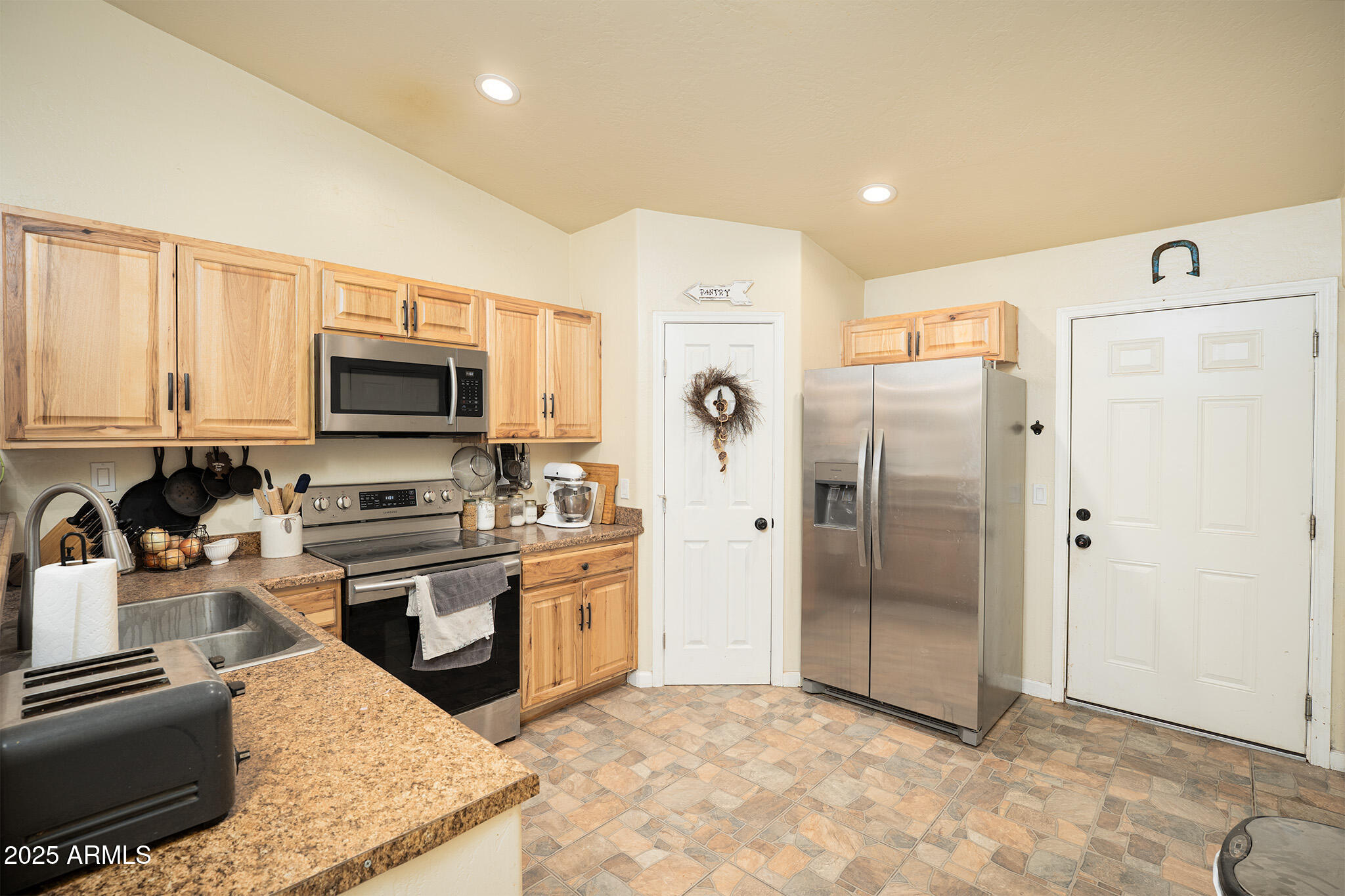 5845 North Bentley Drive Rimrock, AZ 86335 - Photo 12 of 35 a kitchen with stainless steel appliances granite countertop a refrigerator and a stove top oven