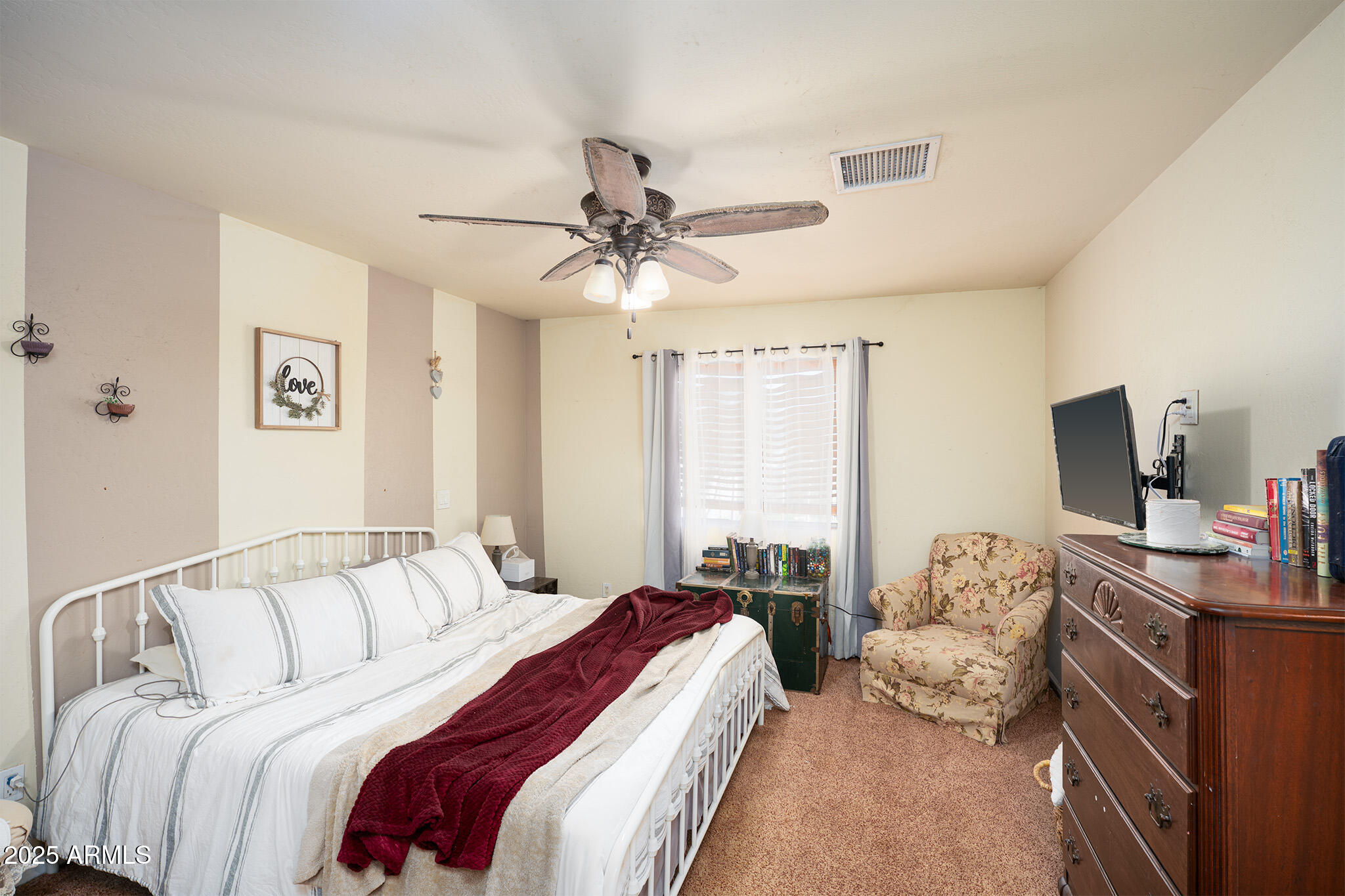 5845 North Bentley Drive Rimrock, AZ 86335 - Photo 16 of 35 a bedroom with a large bed and a window