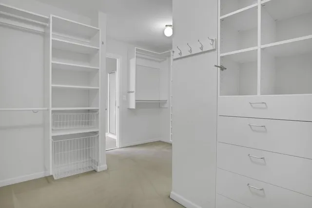 a view of an empty walk in closet