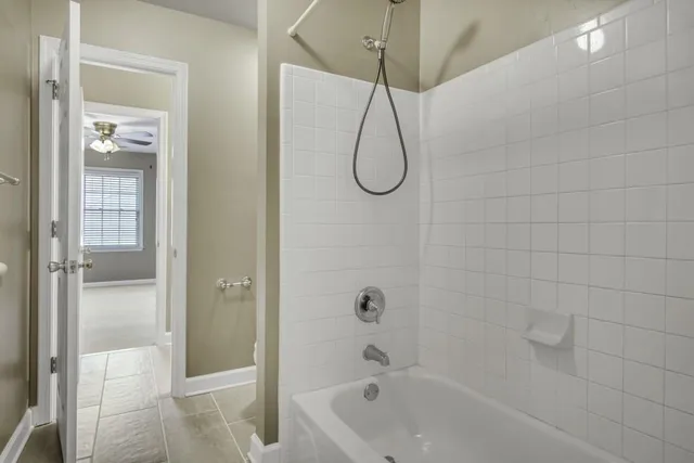 a bathroom with a bath tub and shower