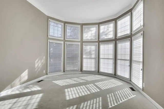 a view of a bedroom with a balcony