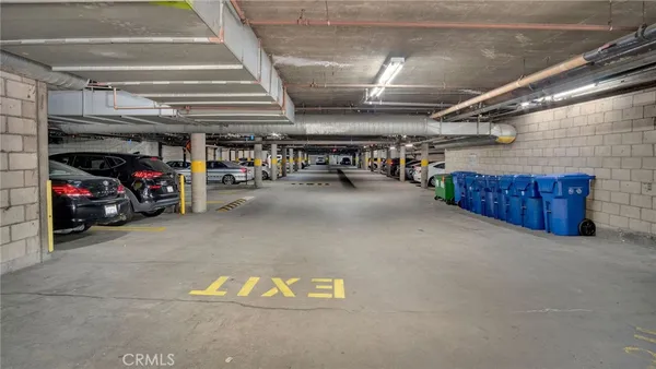 a view of parking garage with cars