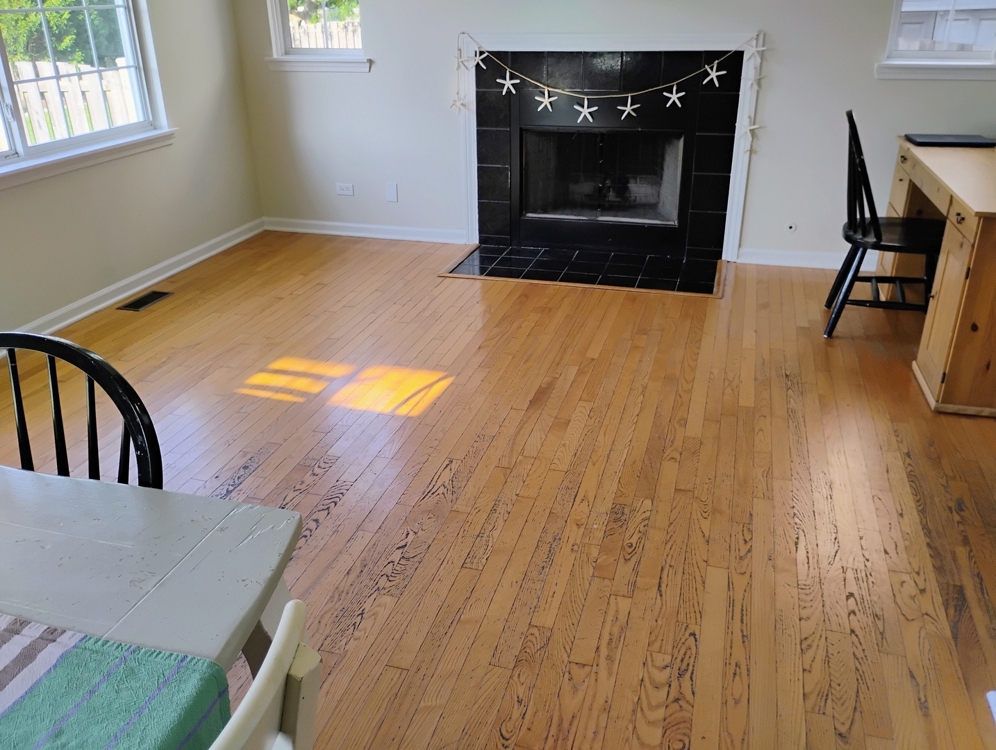 178 West Hampton Drive Round Lake, IL 60073 - Photo 11 of 55 a view of a livingroom with wooden floor and a fireplace