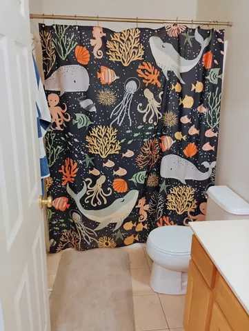 a room with a bed and a cabinet