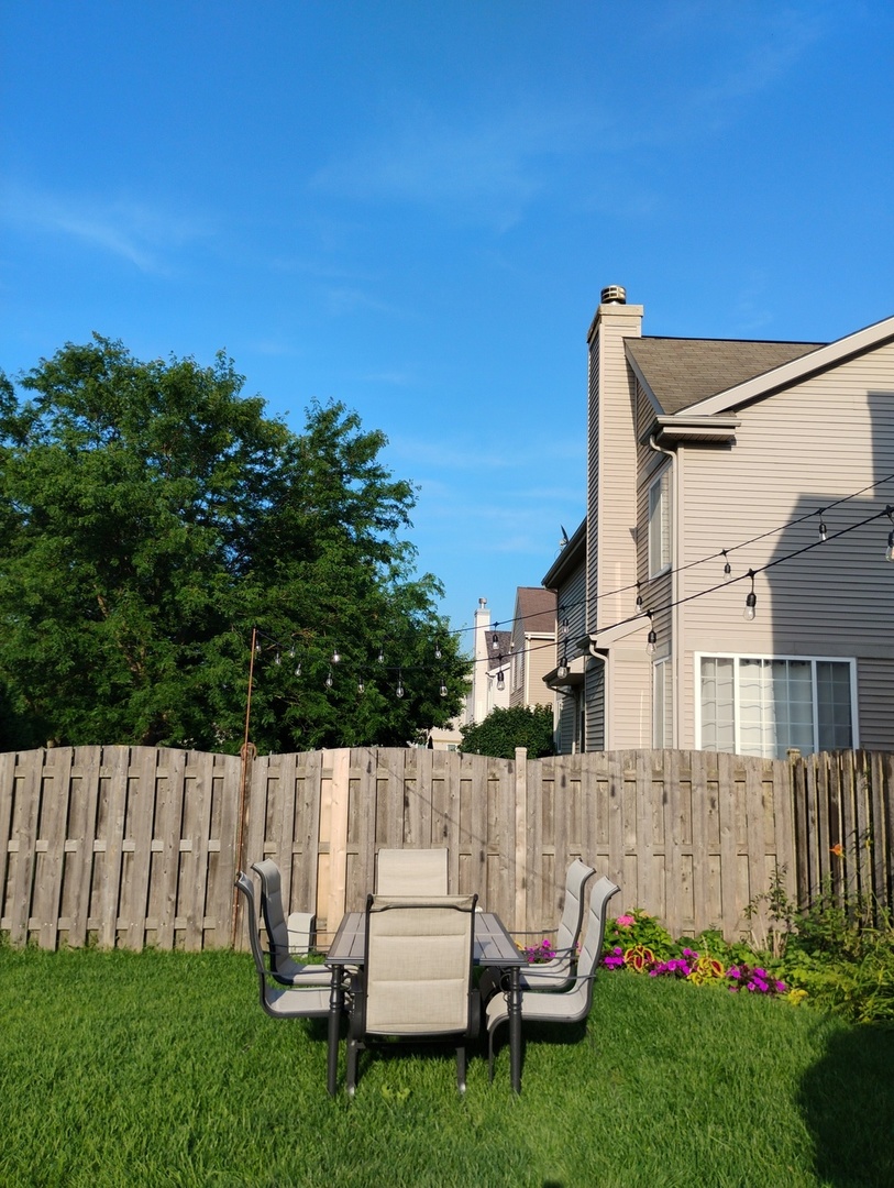 178 West Hampton Drive Round Lake, IL 60073 - Photo 39 of 55 a view of backyard with a chair
