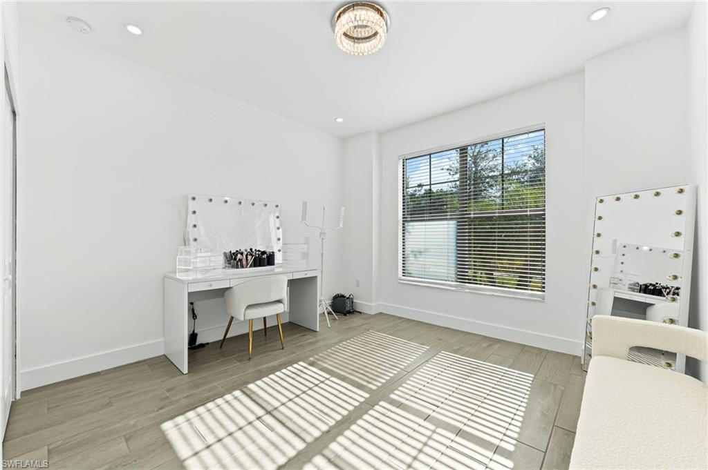 1465 Birdie Drive Naples, FL 34120 - Photo 27 of 38 a room with a window and a table