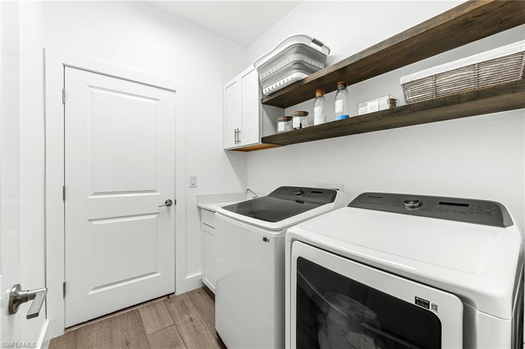 1465 Birdie Drive Naples, FL 34120 - Photo 32 of 38 a utility room with dryer and washer
