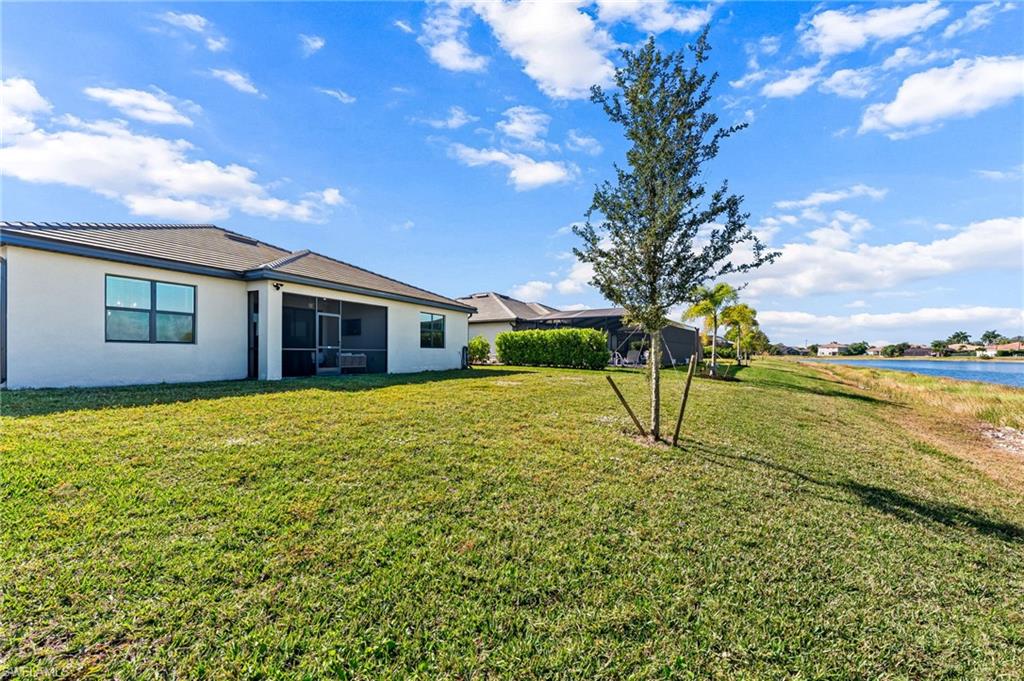 1465 Birdie Drive Naples, FL 34120 - Photo 35 of 38 a house view with a garden space