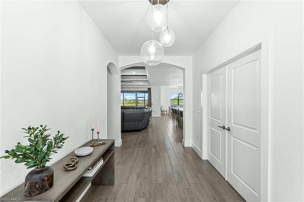 1465 Birdie Drive Naples, FL 34120 - Photo 4 of 38 a view of a hallway to a livingroom with furniture