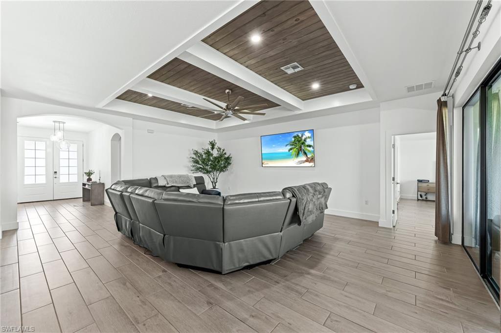 1465 Birdie Drive Naples, FL 34120 - Photo 7 of 38 a living room with furniture and a table