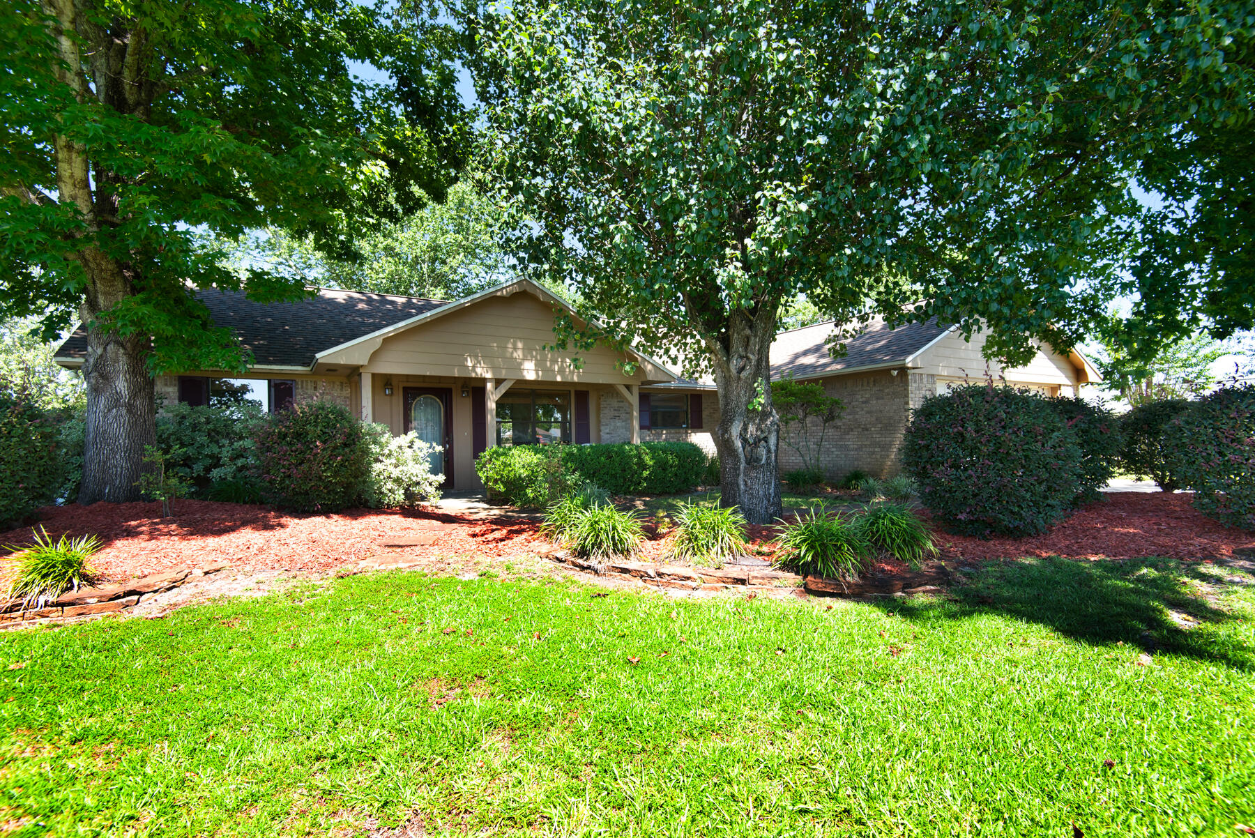 2302 Pentland Road Lynn Haven, FL 32444 - Photo 2 of 40 a front view of a house with a yard and green space