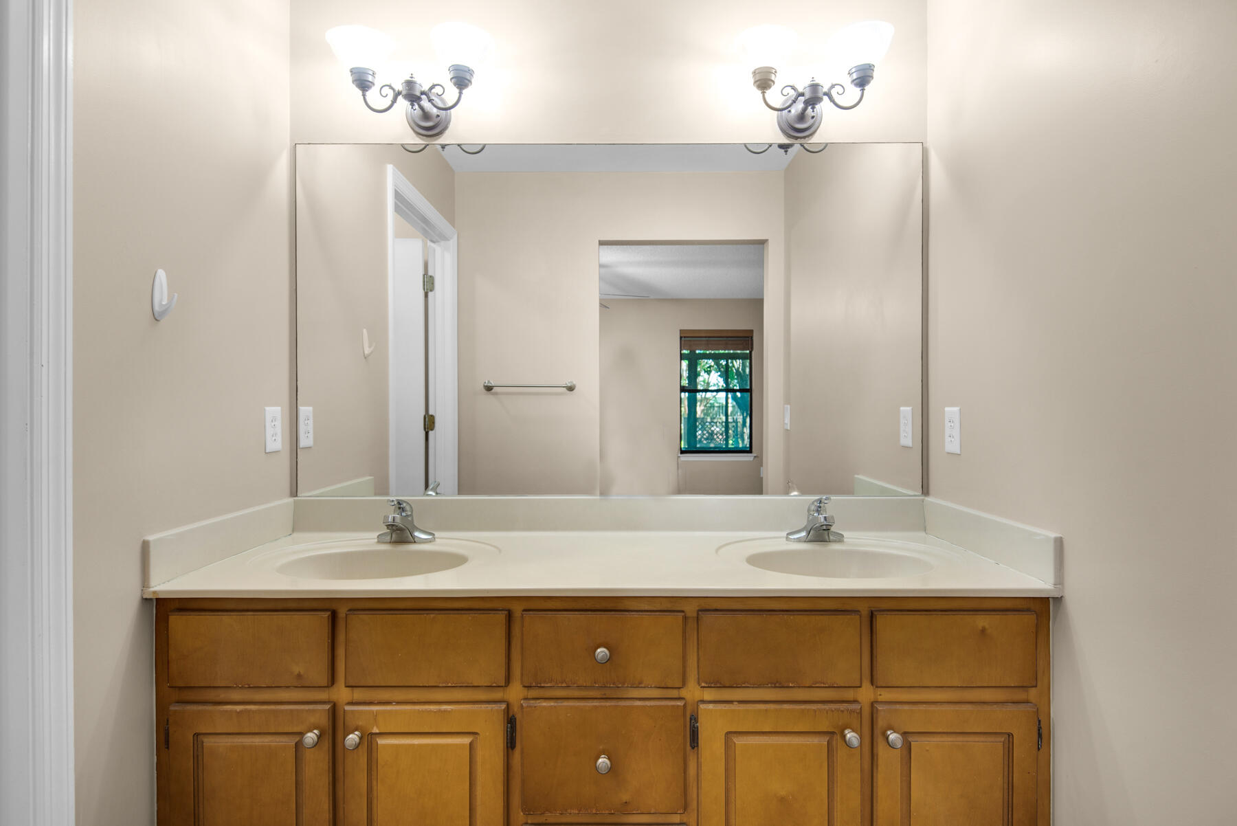 2302 Pentland Road Lynn Haven, FL 32444 - Photo 24 of 40 a bathroom with a sink vanity and a mirror