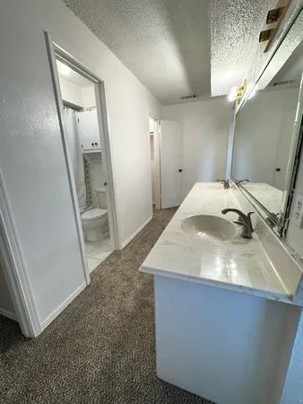 a en suite bathroom with a sink and shower
