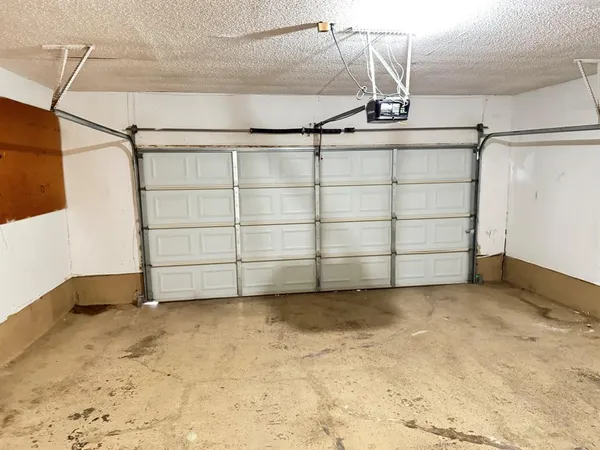 a kitchen with a sink and a refrigerator