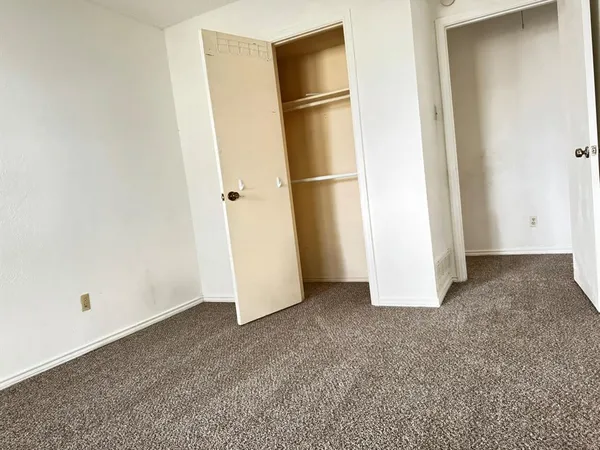 a view of empty room with closet