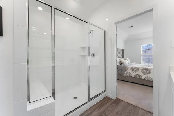 a bathroom with a double vanity sink and mirror