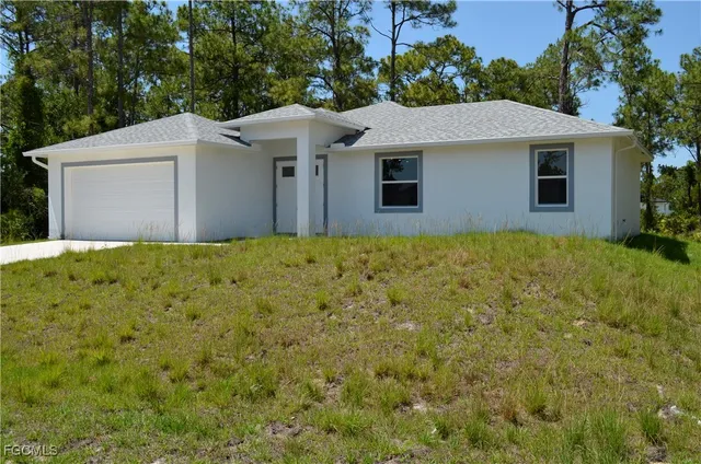 a house with garden in front of it