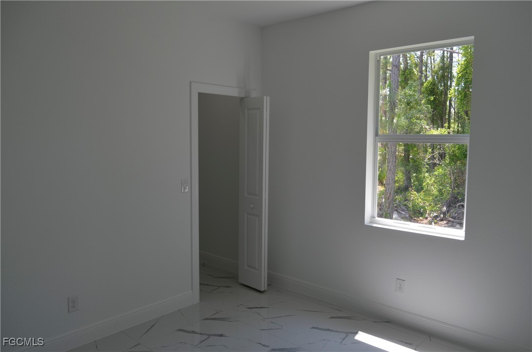 2610 34th Street West Lehigh Acres, FL 33971 - Photo 11 of 14 a view of a small space with a window
