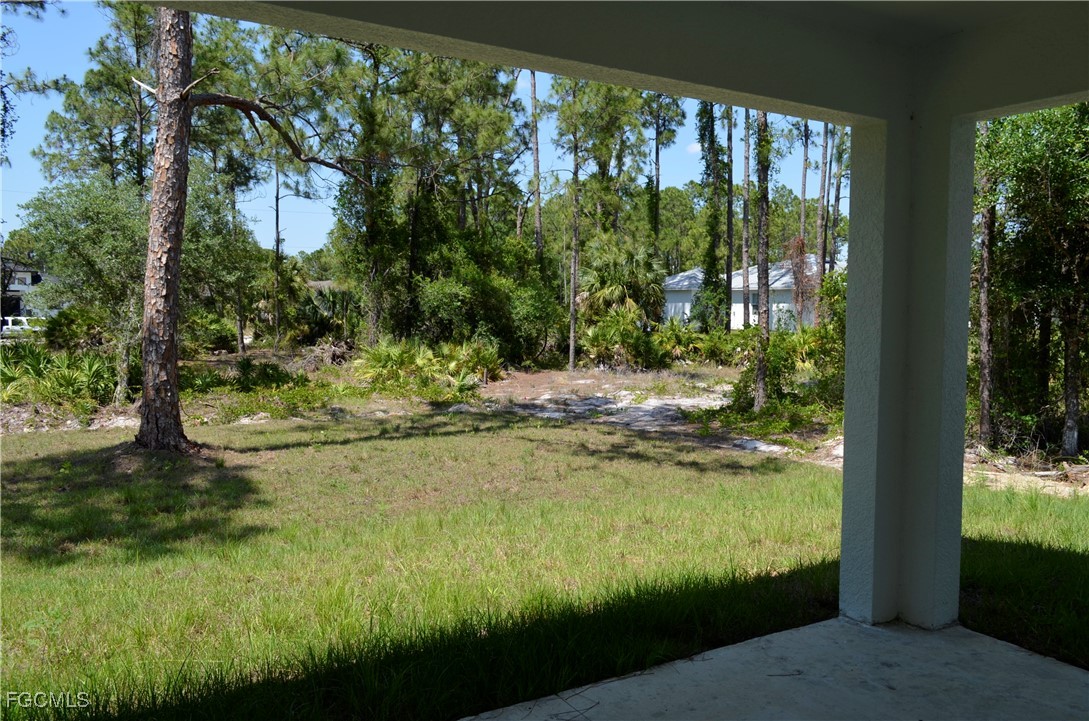 2610 34th Street West Lehigh Acres, FL 33971 - Photo 14 of 14 a view of a lake from a yard