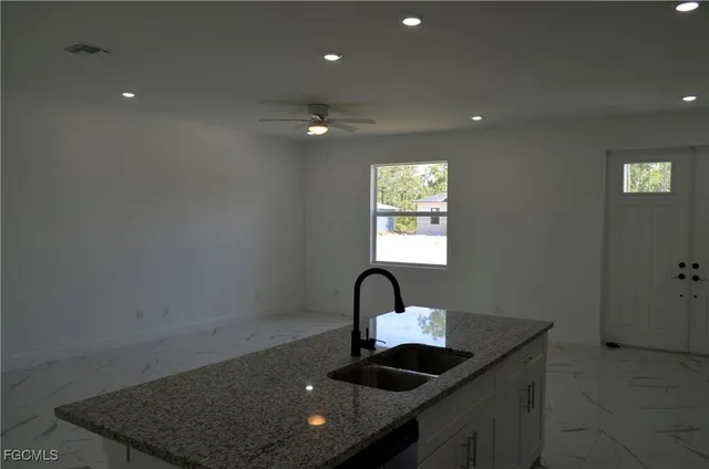 a kitchen with sink and window