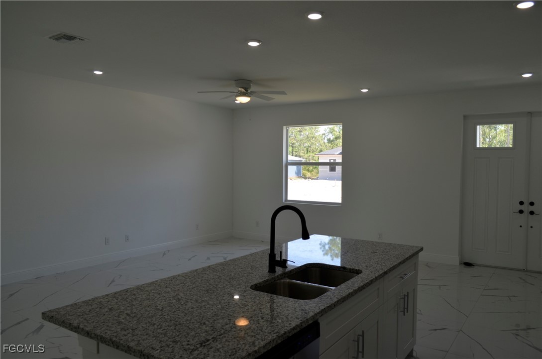2610 34th Street West Lehigh Acres, FL 33971 - Photo 3 of 14 a kitchen with sink and window