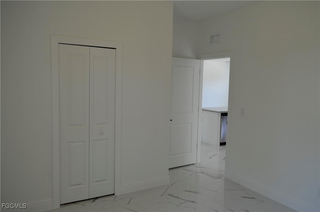 2610 34th Street West Lehigh Acres, FL 33971 - Photo 10 of 14 a view of an empty room